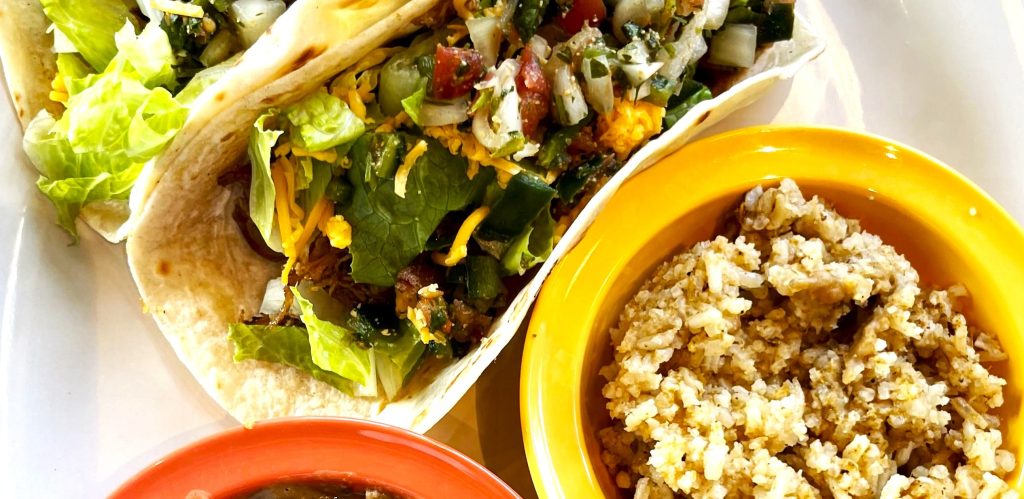 a vegetarian Mexican dish at Las cruces tex mex in Metairie, taco with veggies and rice salad