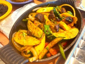 Delicious fajitas with fresh veggies served at Las Cruces Tex Mex, the go-to Mexican restaurant in Metairie for authentic Mexican food.