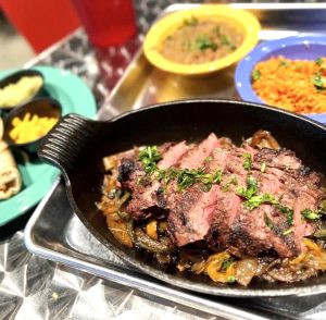 Authentic beef fajitas, a classic Mexican food specialty, presented by Las Cruces Tex Mex in Metairie.