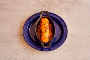 A savory beef enchilada from Las Cruces Tex Mex, showcasing the rich and bold flavors of traditional Mexican food in Metairie.
